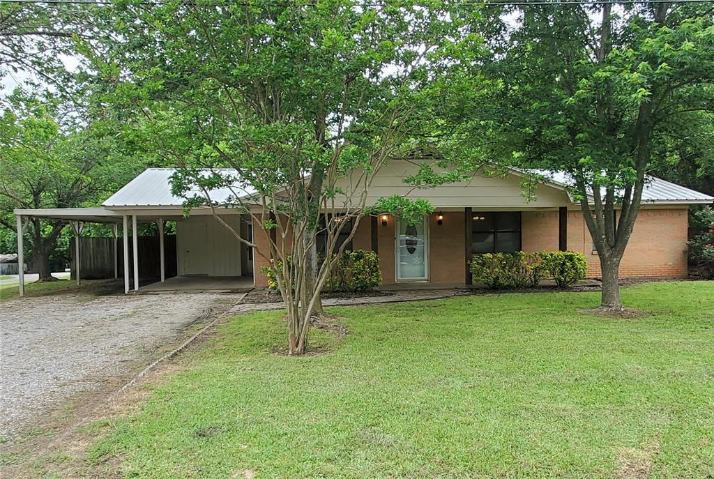 201 Caney Street Dodd City, TX 75438 - Photo 1 of 1 a front view of a house with a garden