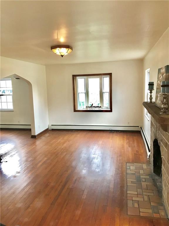 Another view of the spacious living room with bay window.