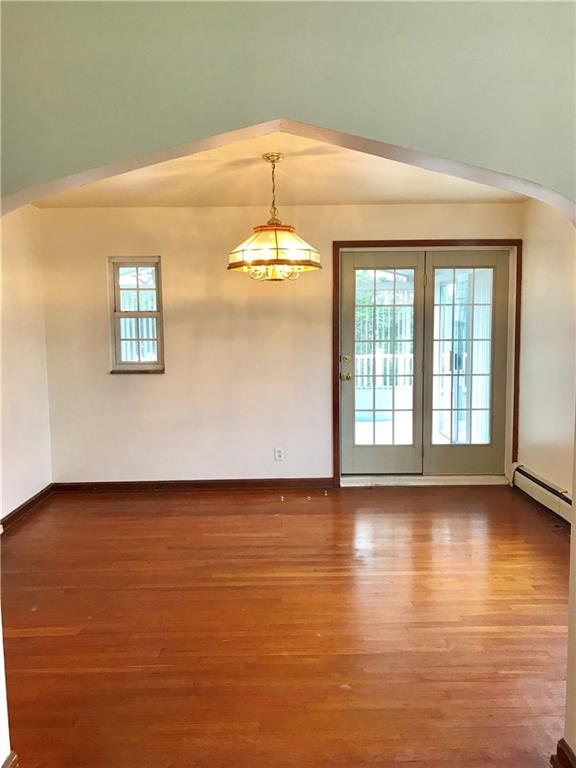 Dining room with French doors leading to sunporch.