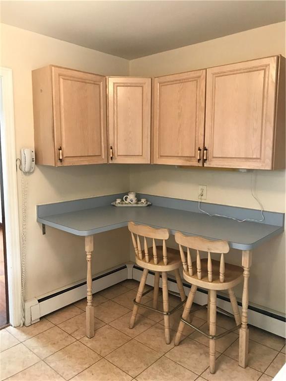 Another view of the kitchen - great storage and a breakfast bar. 