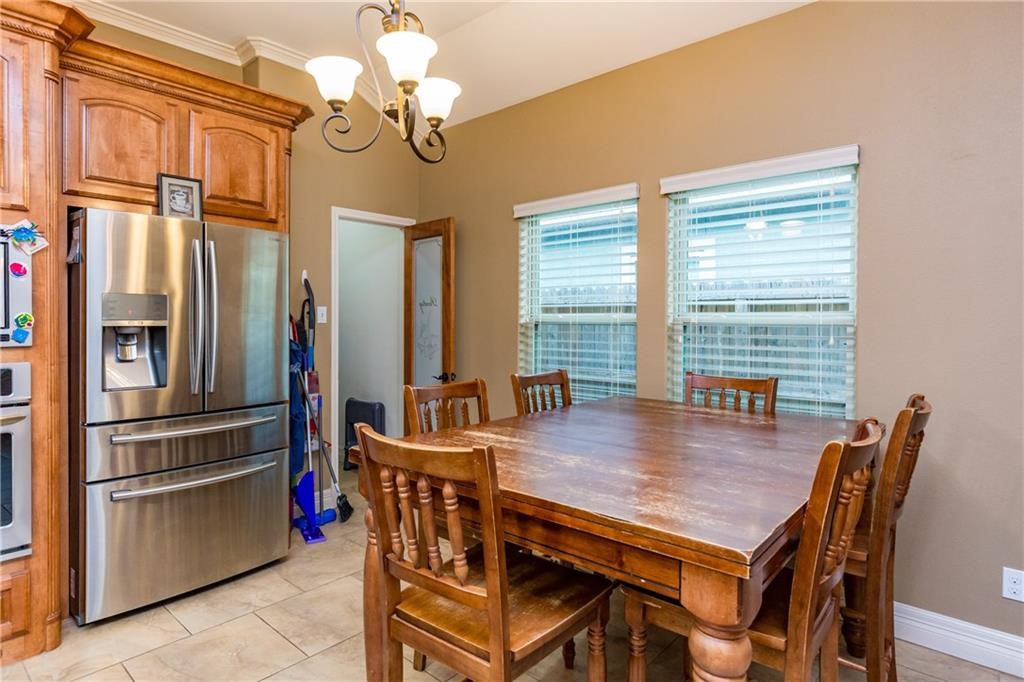 1306 Keenland Road Corpus Christi, TX 78418 - Photo 5 of 26 a view of a dining room with furniture window and wooden floor