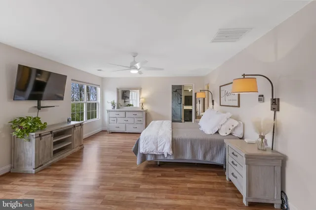 a front view of a building with a yard