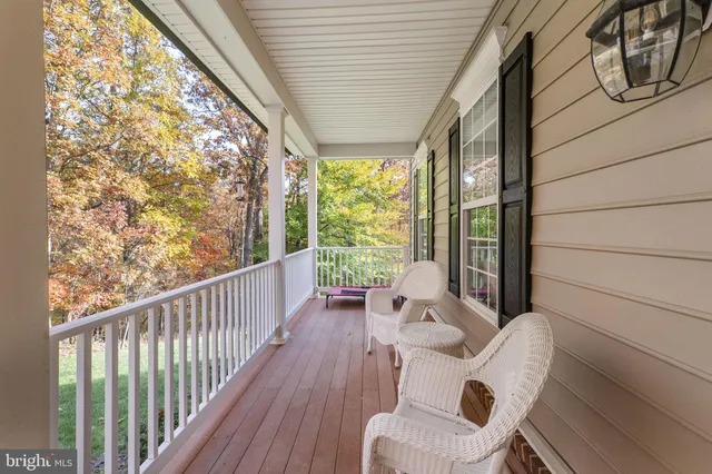 a kitchen with stainless steel appliances granite countertop a stove a sink dishwasher and cabinets with wooden floor