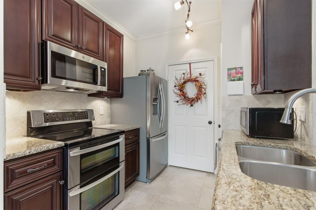 2524 Preston Road, Unit 1607 Plano, TX 75093 - Photo 16 of 28 Kitchen with Double Oven Range, Microwave and refrigerator freezer