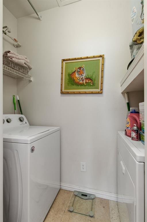 2524 Preston Road, Unit 1607 Plano, TX 75093 - Photo 23 of 28 Laundry with washer & dryer & water heater