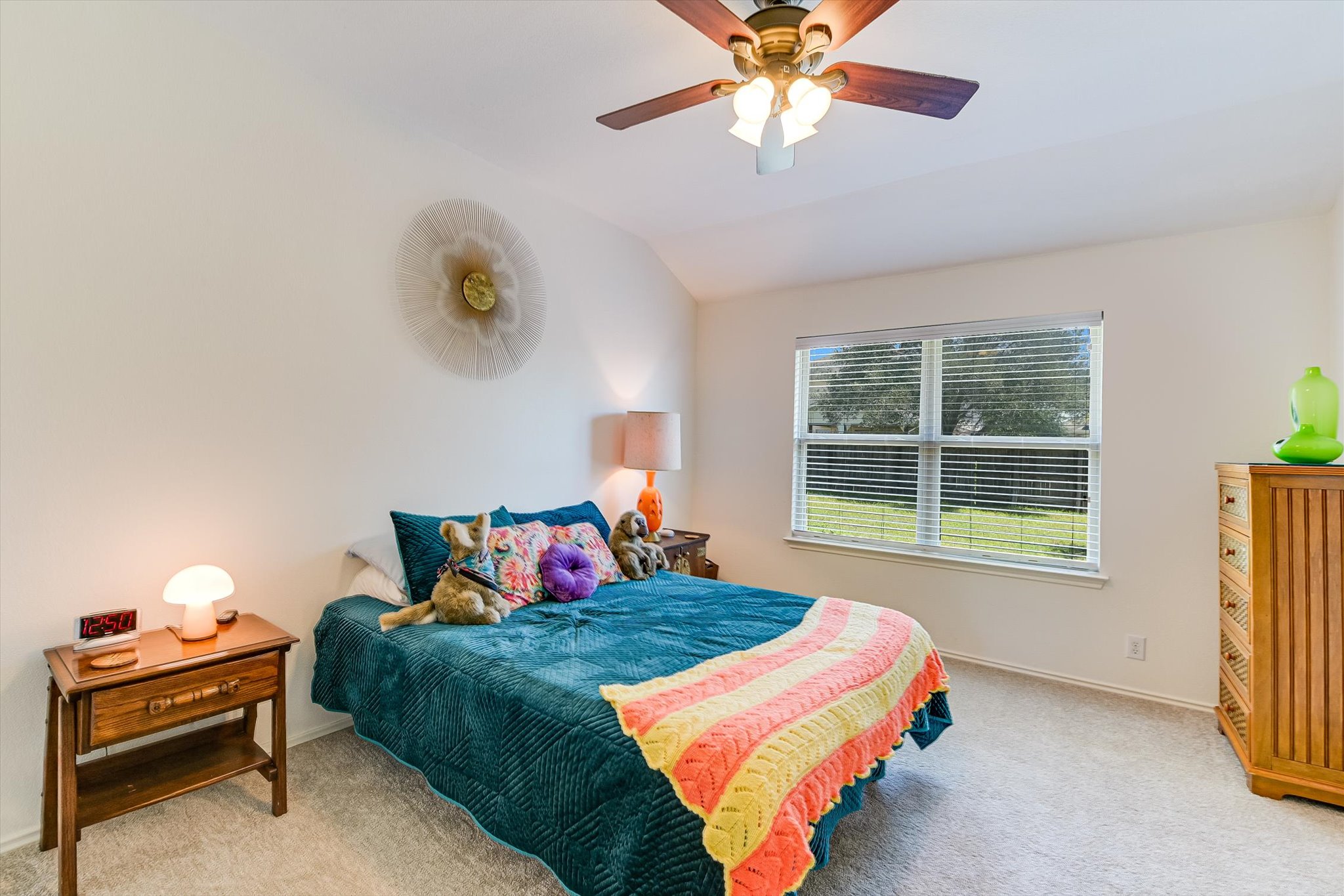 536 Dragon Ridge Road Buda, TX 78610 - Photo 11 of 20 Carpeted bedroom featuring a vaulted ceiling and a wood-finish ceiling fan with integrated lighting