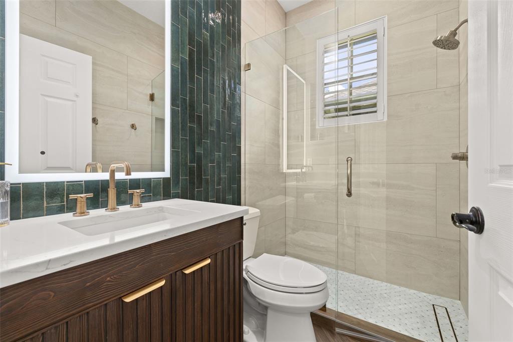 8351 Bowden Way Windermere, FL 34786 - Photo 31 of 71 a bathroom with a sink a toilet and shower