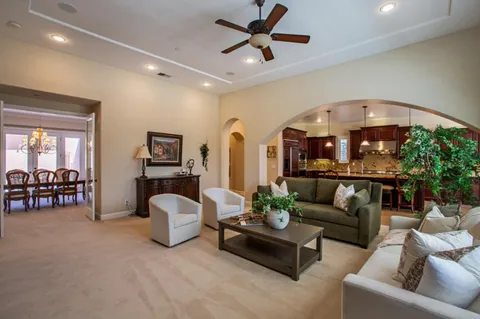 a living room with furniture and a table