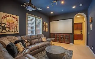 a living room with furniture a large window and a flat screen tv