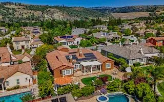 an aerial view of a house with a garden