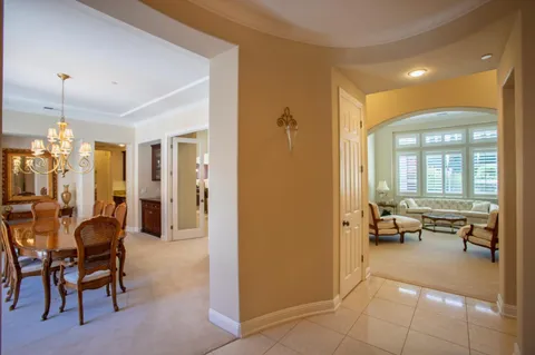 a lobby with furniture and floor to ceiling window