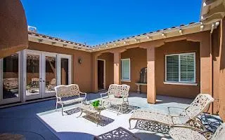 a outdoor space with patio the couch and wooden floor