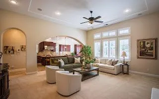 a living room with furniture and a large window