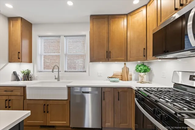 a kitchen with a sink stove top oven and cabinets