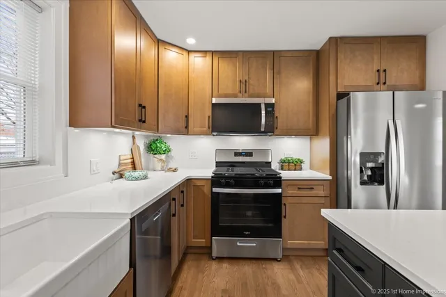 a kitchen with a sink stove and refrigerator