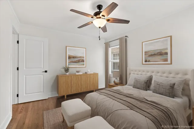 a bedroom with furniture and wooden floor