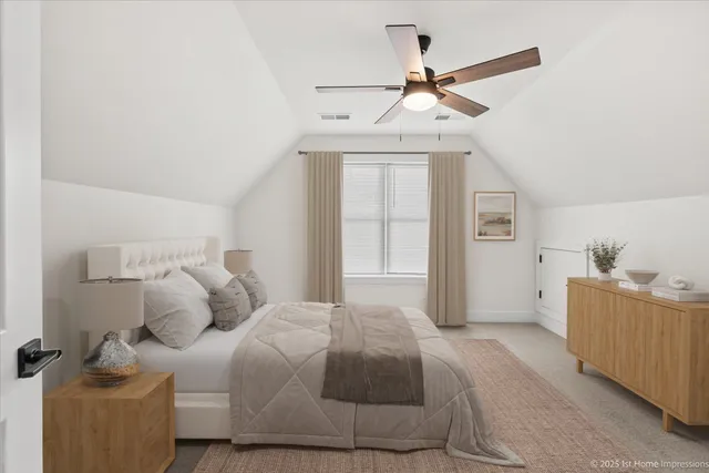 a bedroom with a bed and a ceiling fan