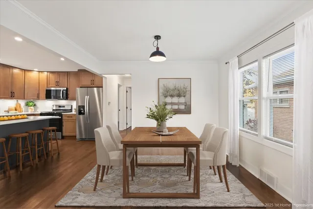 a view of a dining room with furniture window and wooden floor