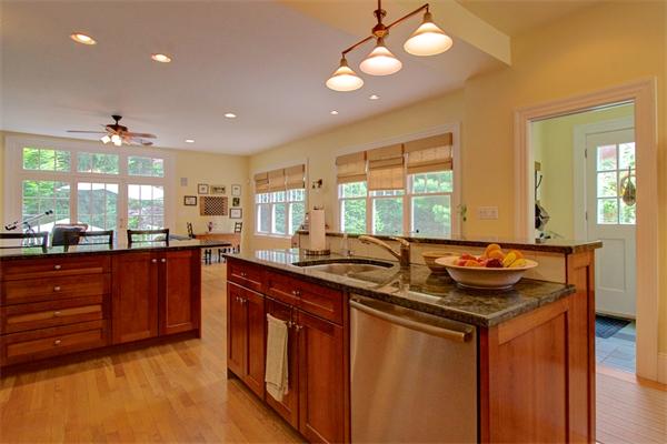 6 Glen Road Winchester, MA 01890 - Photo 12 of 30 a kitchen with stainless steel appliances granite countertop a sink and stove