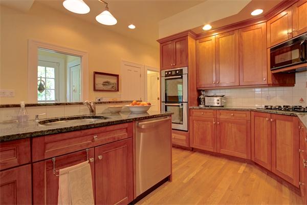 6 Glen Road Winchester, MA 01890 - Photo 14 of 30 a kitchen with stainless steel appliances granite countertop a stove a sink and a refrigerator