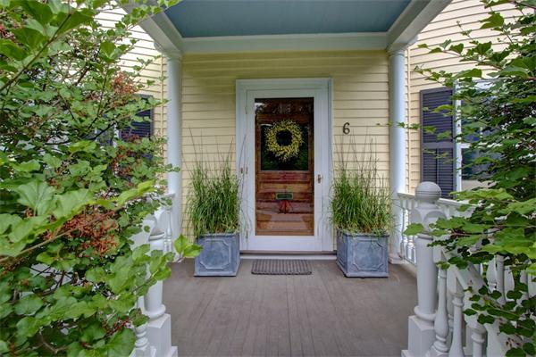 6 Glen Road Winchester, MA 01890 - Photo 2 of 30 a potted plant sitting in front of a house