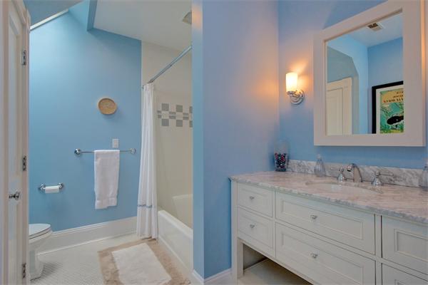 6 Glen Road Winchester, MA 01890 - Photo 21 of 30 a bathroom with a sink and mirror with shower