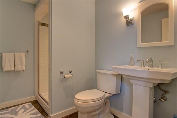 6 Glen Road Winchester, MA 01890 - Photo 24 of 30 a bathroom with a sink toilet and a mirror