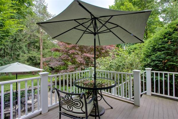 6 Glen Road Winchester, MA 01890 - Photo 25 of 30 a view of an outdoor sitting area with furniture and umbrella