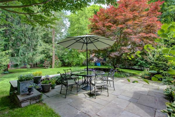 6 Glen Road Winchester, MA 01890 - Photo 26 of 30 a view of a table and chairs under an umbrella