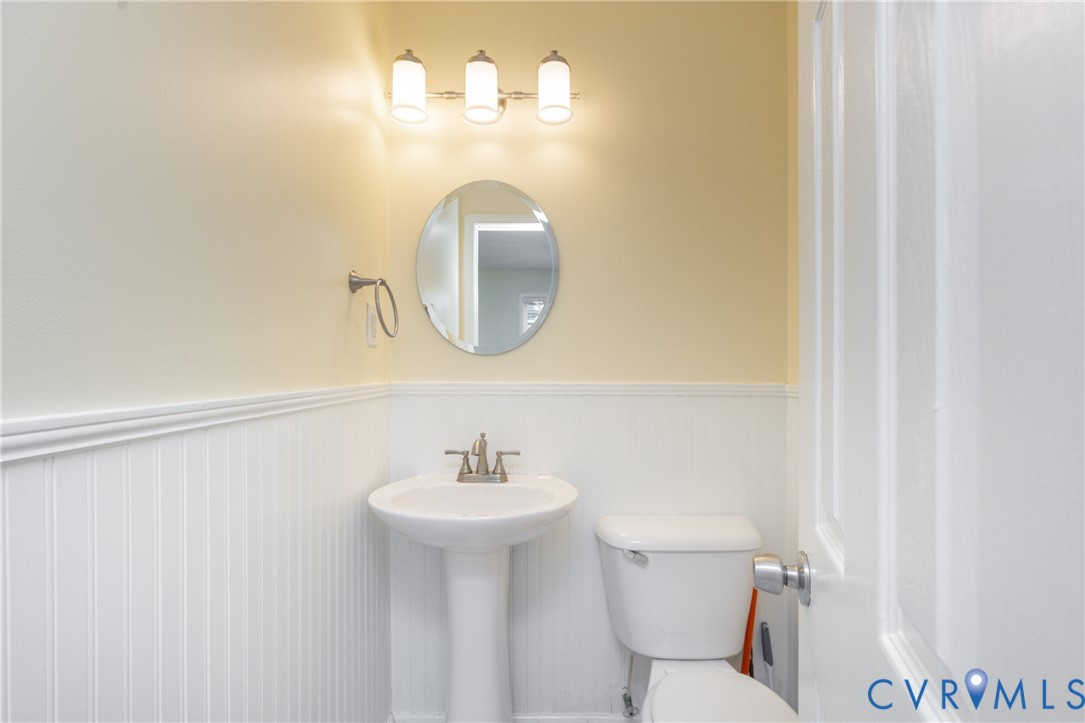 5101 Spring Bluff Road Midlothian, VA 23112 - Photo 23 of 47 Powder room featuring a pedestal sink, oval mirror