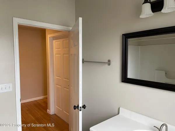 a bathroom with a shower and a sink