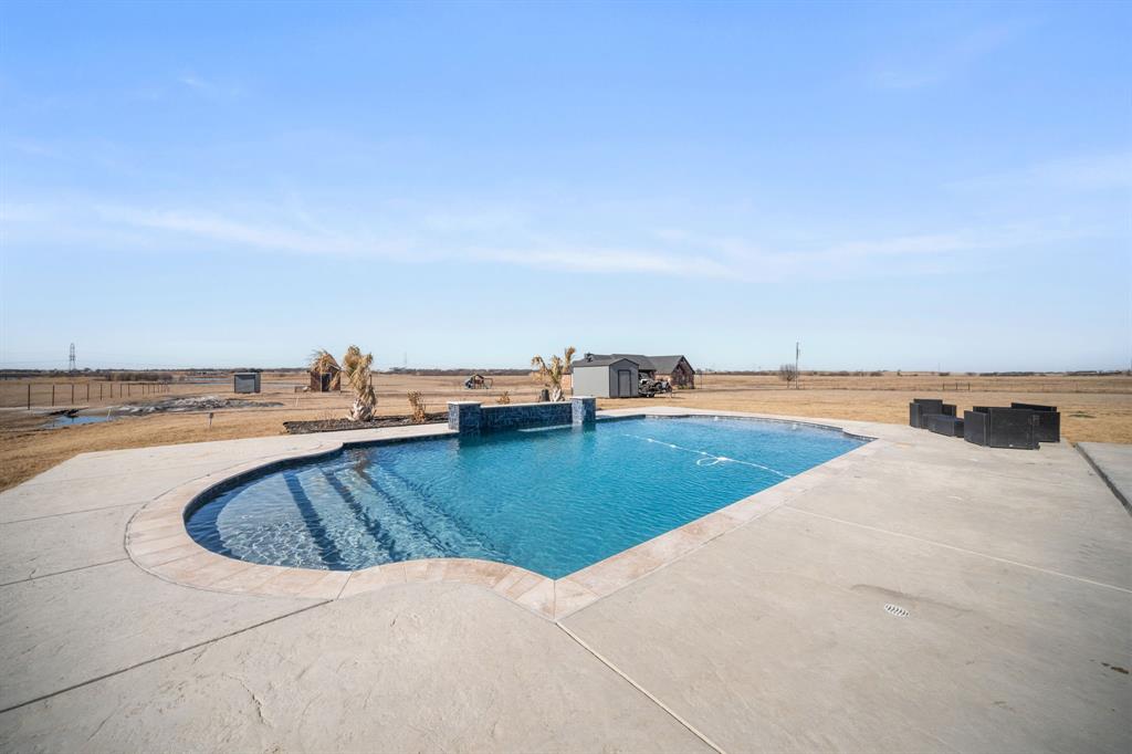 10405 Singleton Road Midlothian, TX 76065 - Photo 2 of 39 Swimming pool featuring a patio area and a storage shed