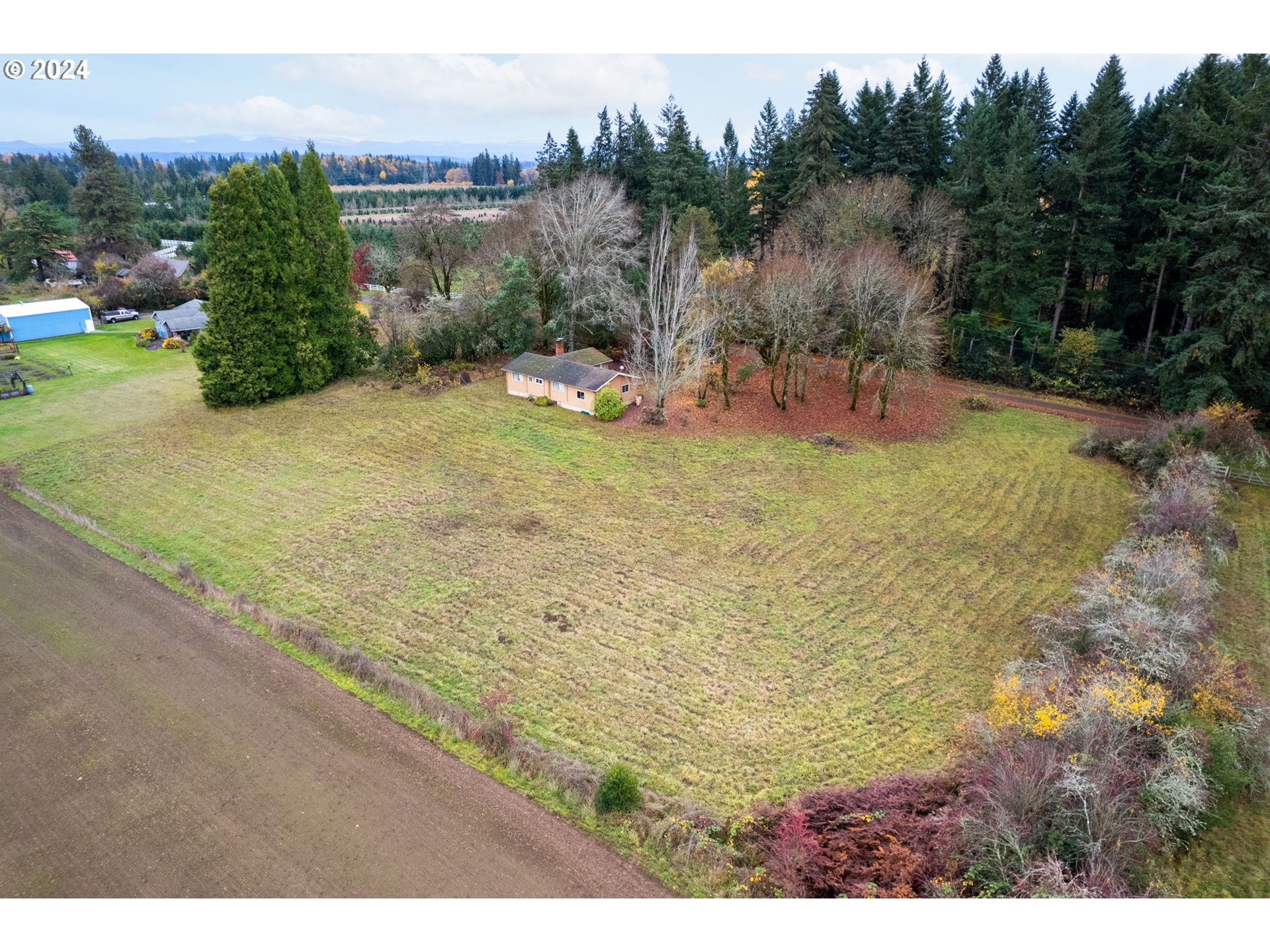 5565 Southwest Kruse Road Wilsonville, OR 97070 - Photo 2 of 28 a view of a park with large trees