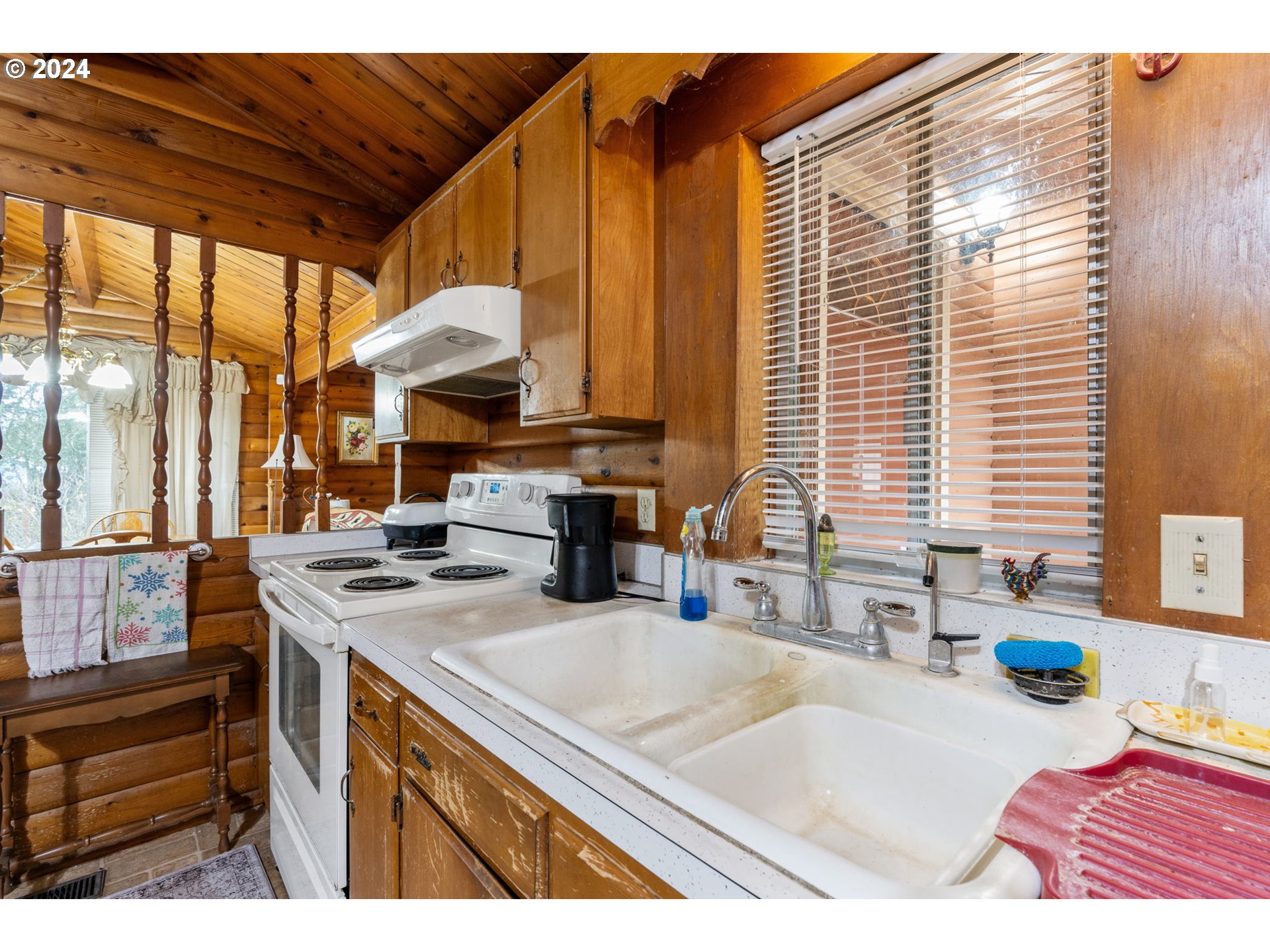 5565 Southwest Kruse Road Wilsonville, OR 97070 - Photo 7 of 28 a kitchen with stainless steel appliances granite countertop a sink a stove and a microwave