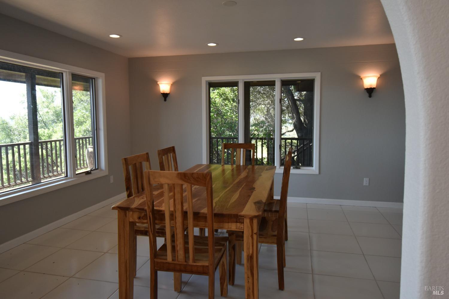 7490 Walnut Lane Lower Lake, CA 95457 - Photo 23 of 44 a view of a dining room with furniture window and outside view