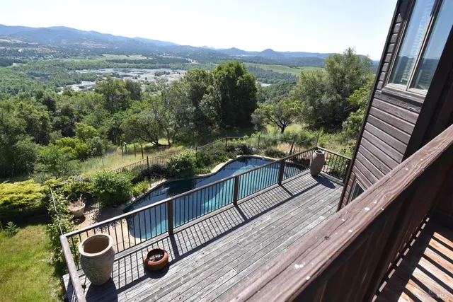 a view of a lake from a balcony