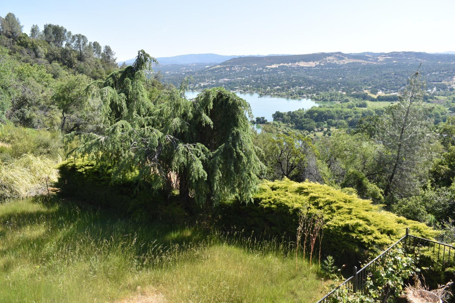 7490 Walnut Lane Lower Lake, CA 95457 - Photo 34 of 44 a view of a lake with a mountain in the background