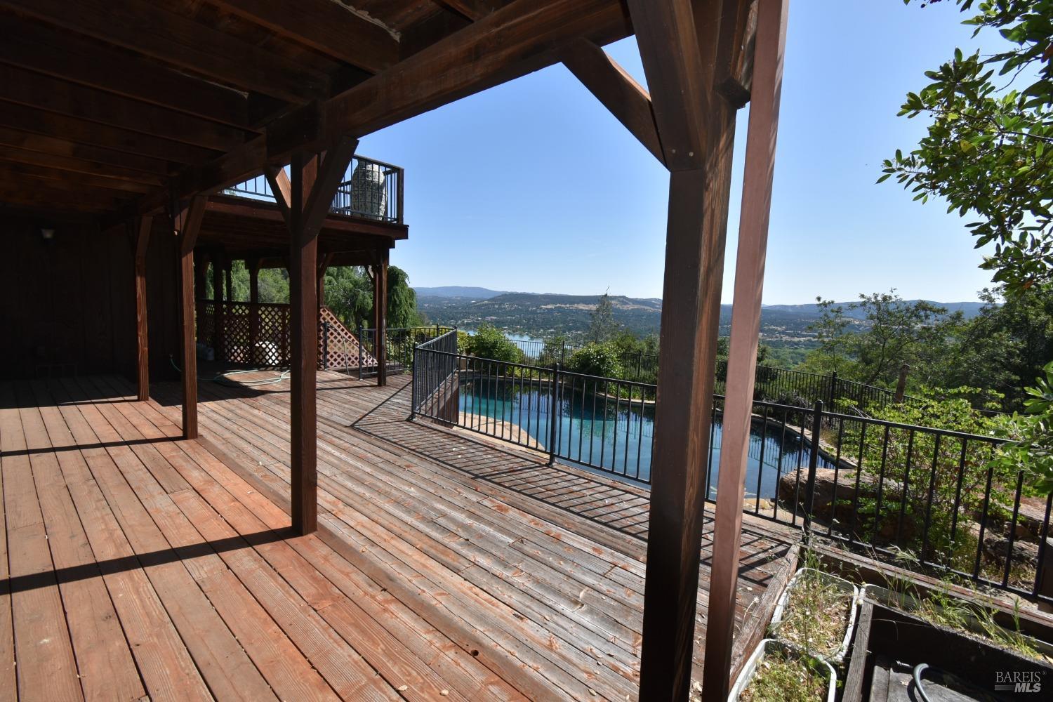 7490 Walnut Lane Lower Lake, CA 95457 - Photo 36 of 44 a view of a balcony with wooden floor
