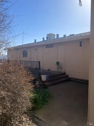 a view of backyard and garage