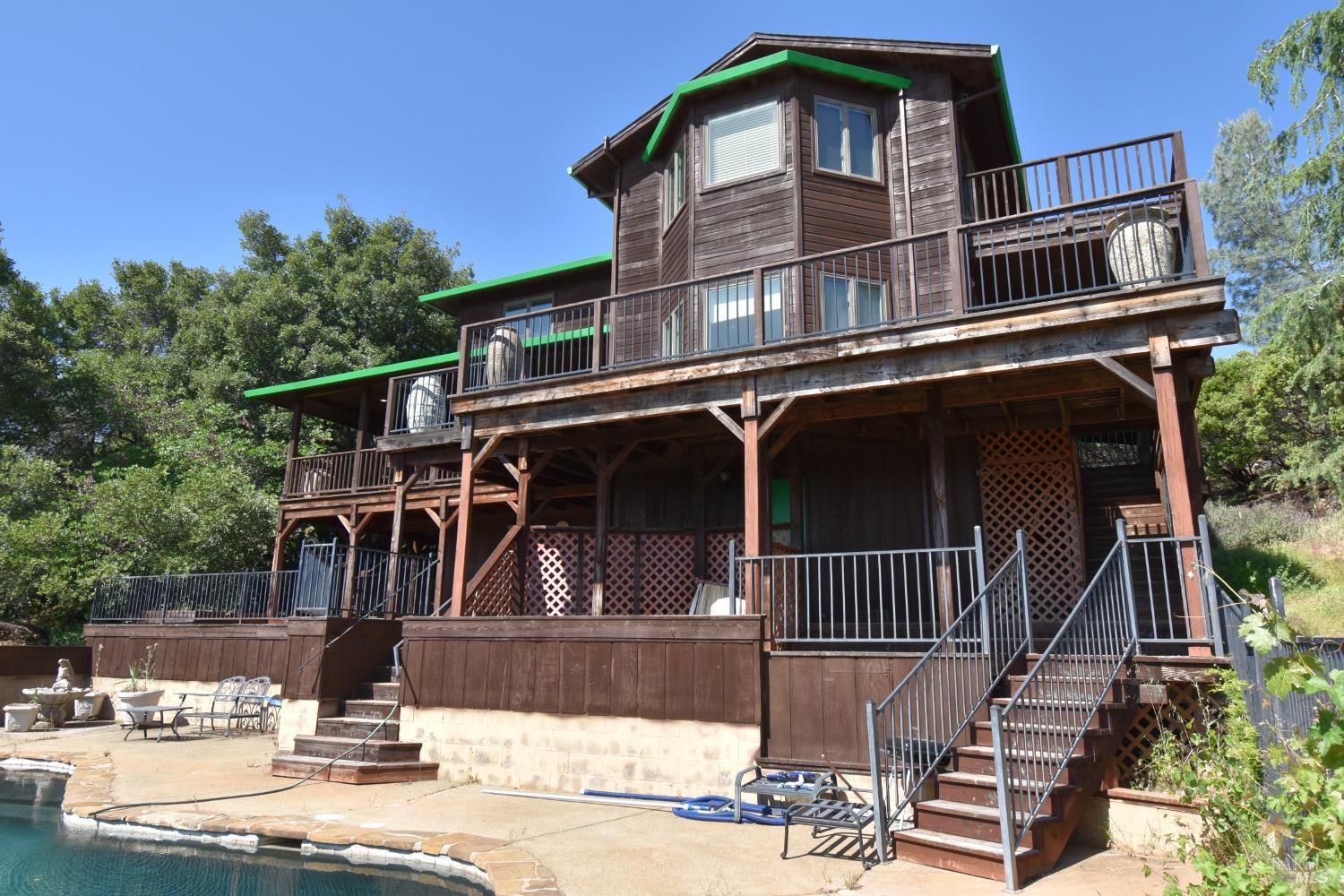 7490 Walnut Lane Lower Lake, CA 95457 - Photo 4 of 44 a front view of a house with garage