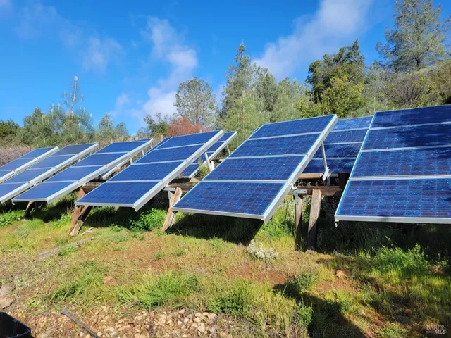 a view of a backyard with sitting area