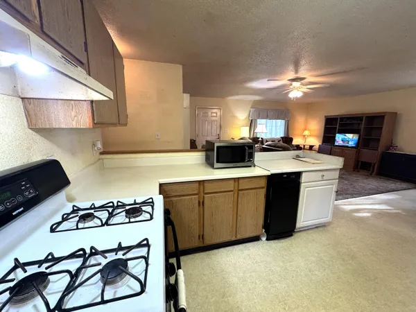 a kitchen with counter top space and stainless steel appliances