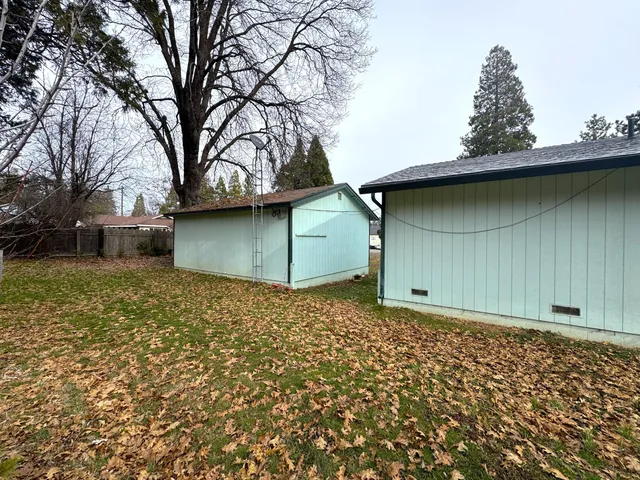 a view of street with parked cars