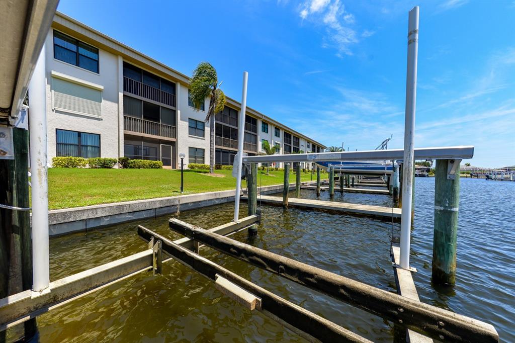 335 Coldeway Drive, Unit F21 Punta Gorda, FL 33950 - Photo 37 of 45 a view of swimming pool with a lounge chairs