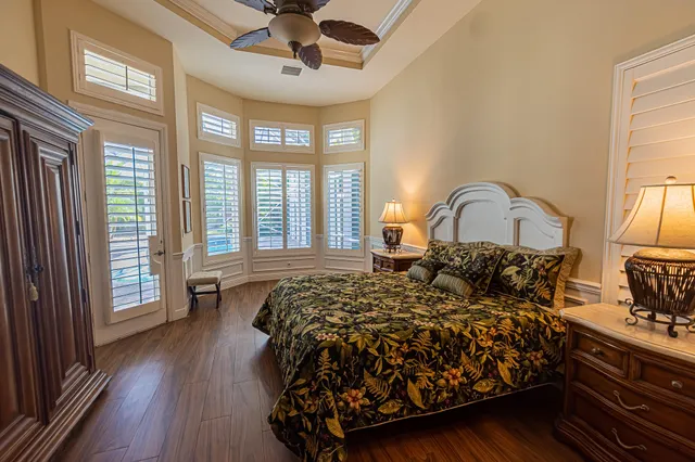 a bedroom with a large bed and a large window
