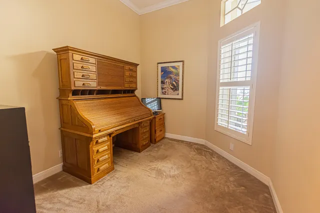 a bed room with a bed and a window