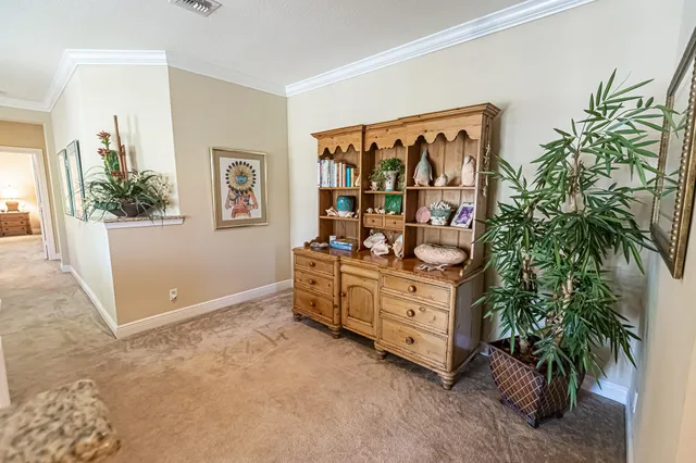 a bathroom with a granite countertop sink mirror vanity and toilet