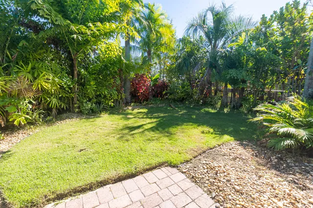 a backyard of a house with lots of green space