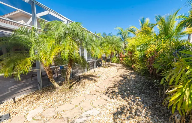 a aerial view of a house with a yard and garden