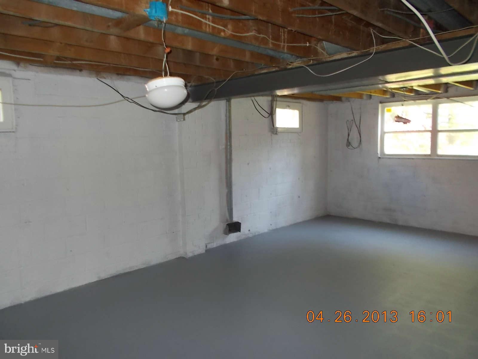 3302 Harrell Street Silver Spring, MD 20906 - Photo 15 of 18 a view of a room with wooden floor and windows